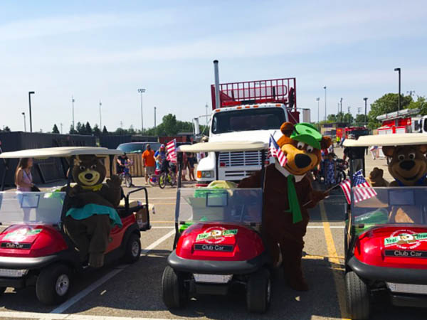 Guests enjoying golf cart rentals at Jellystone Park South Haven